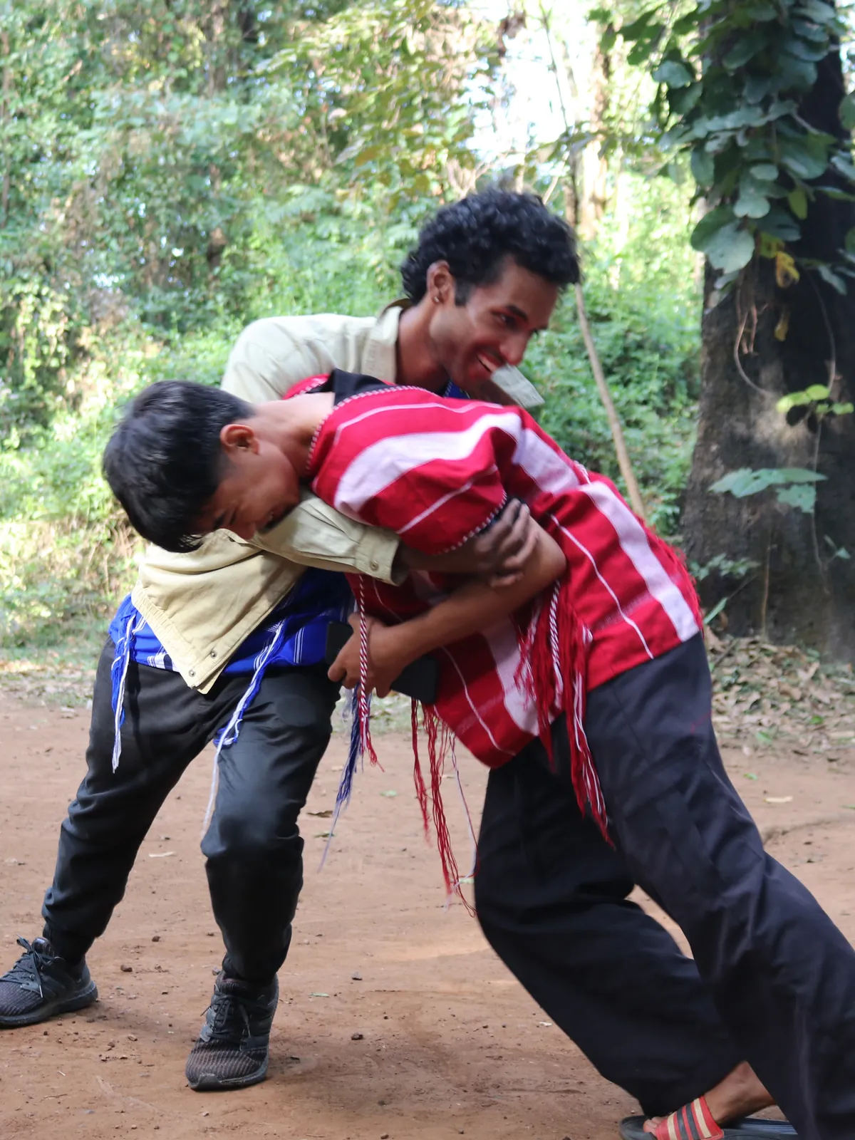 Sai in a group hug with friends